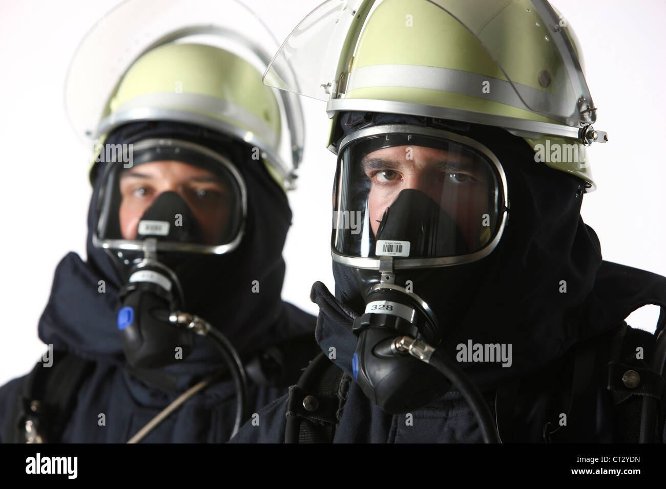 Fire men with Breathing apparatus and fire fighting equipment, fire service, fire brigade Stock