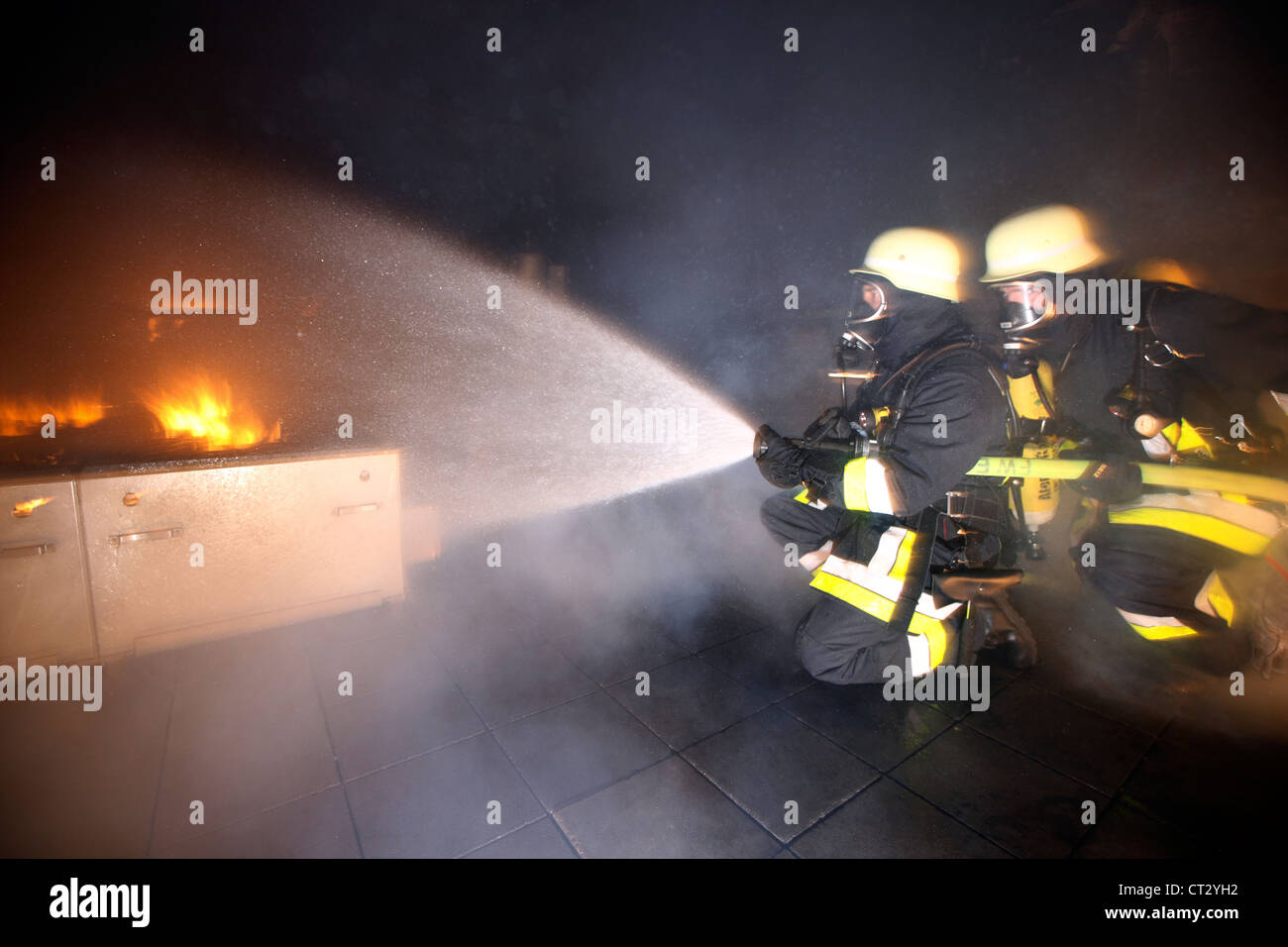 Fire service, fire men, fire fighting training at a fire training house