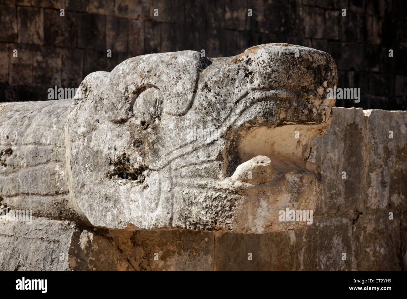 Mayan carving of a snake head adorning a ruin at the city of Chichen Itza, Yucatan, Mexico. Stock Photo