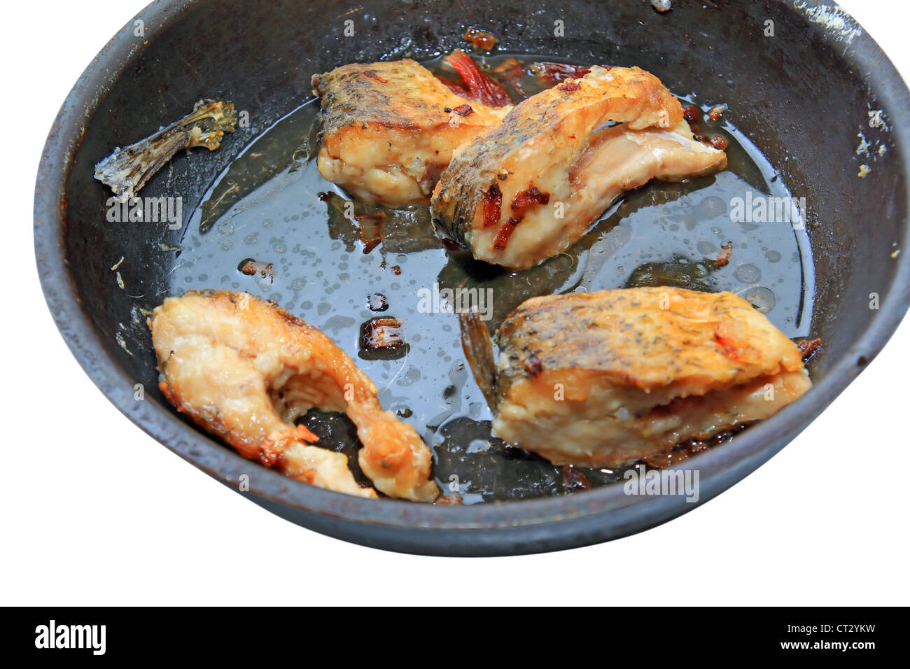 roasted fish on black griddle Stock Photo