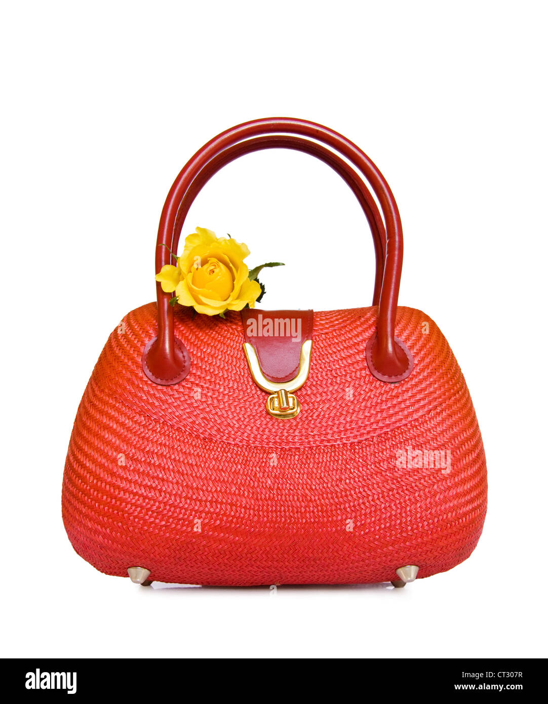 Vintage red straw handbag with yellow rose. Isolated over white background. Stock Photo