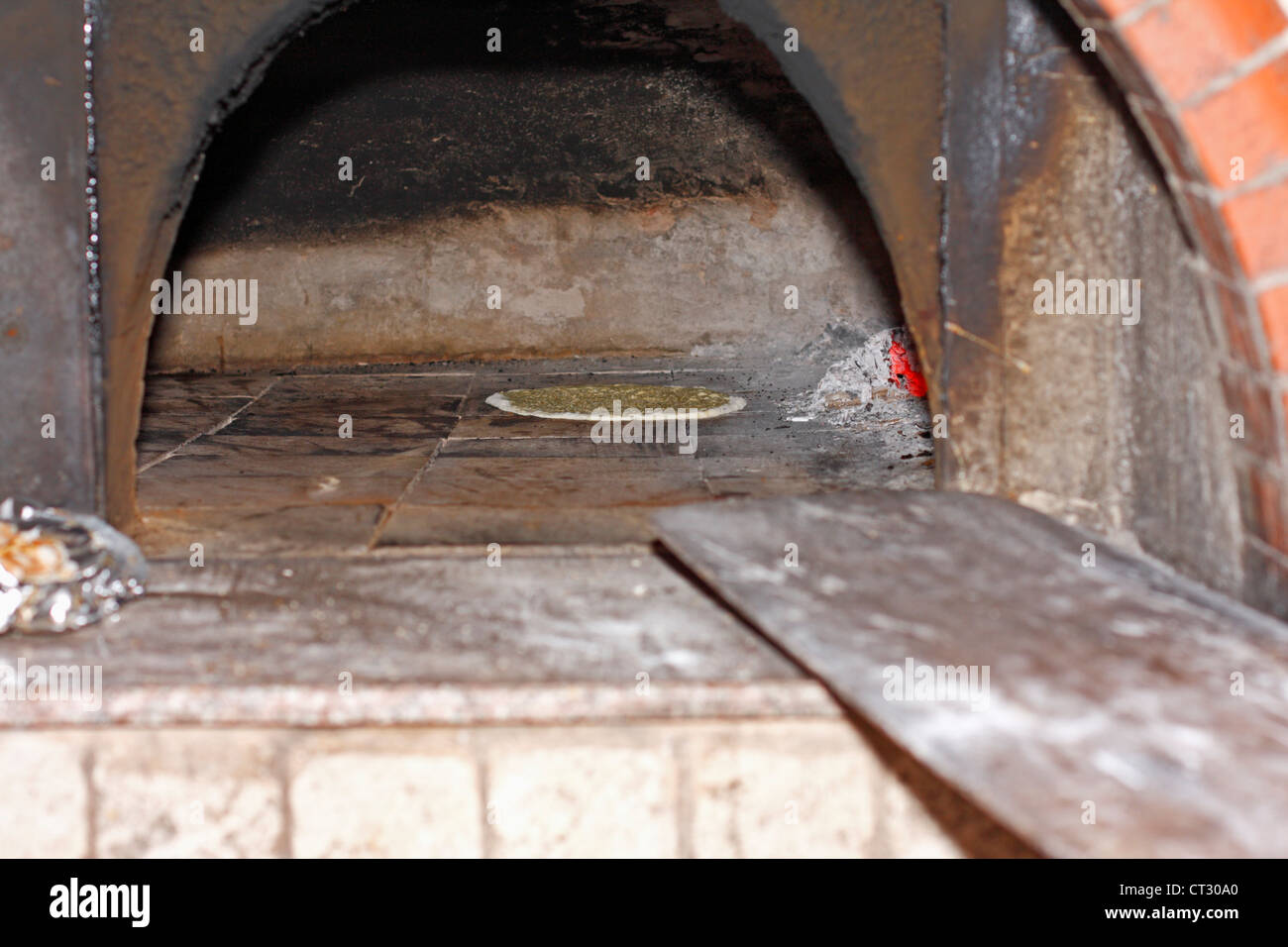 Bread baking in a traditional Turkish brick oven Tonoz Beach Hotel