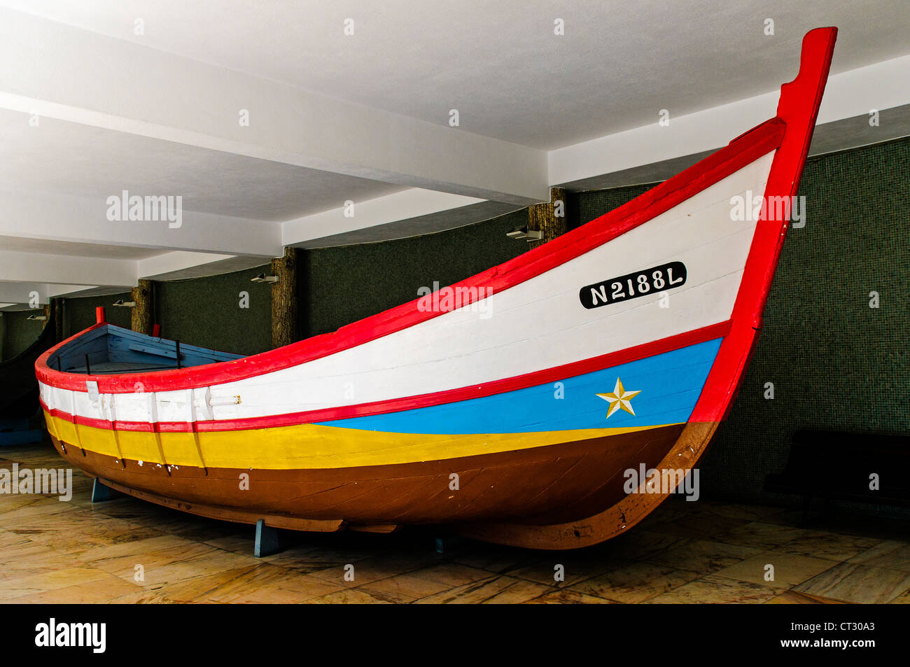 A refurbished old cargo river boat repainted in it's original colours and put on display at the Maritime Museum, Lisbon Stock Photo