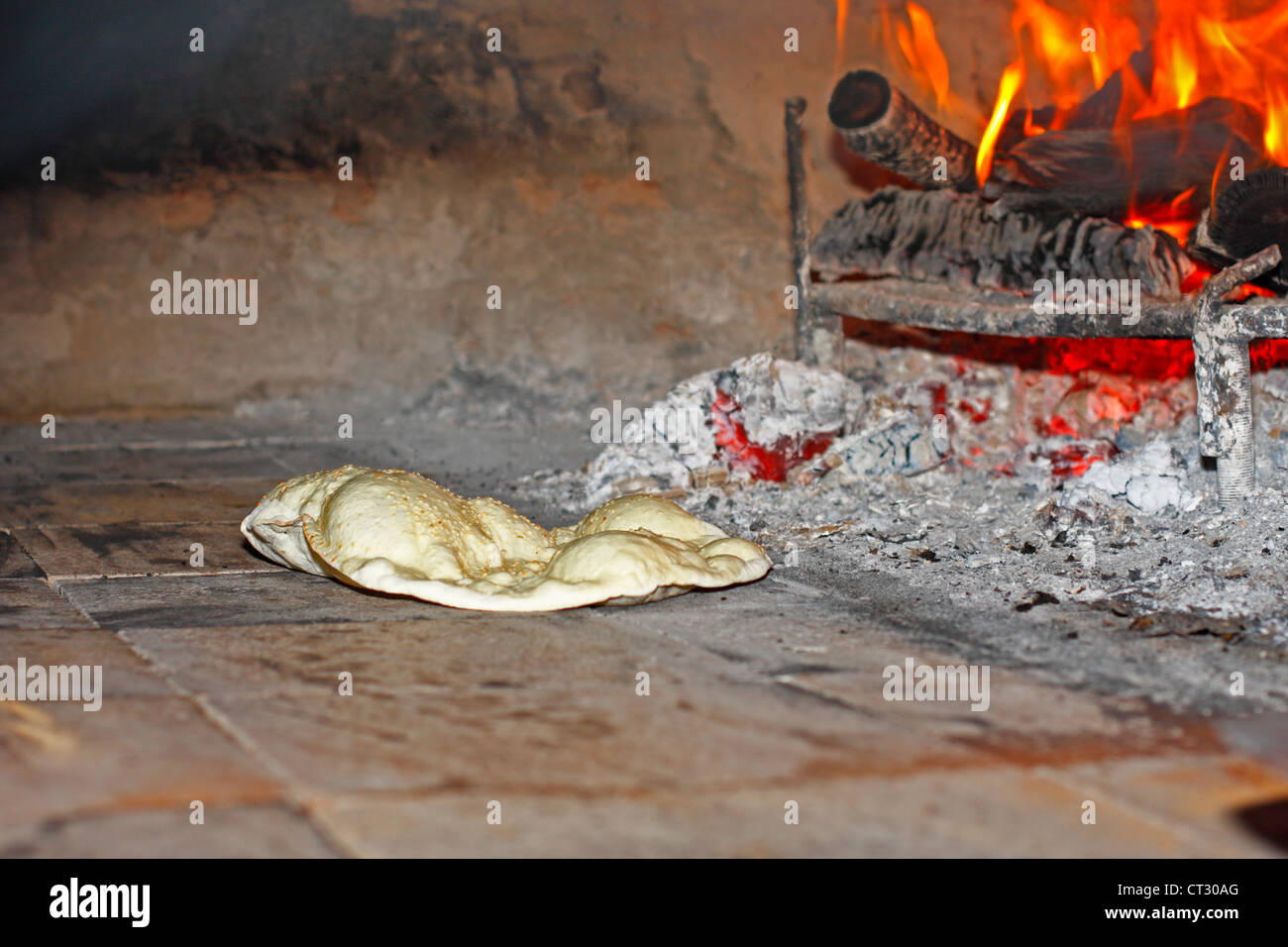 Baking Bread In Brick Oven High Resolution Stock Photography and Images