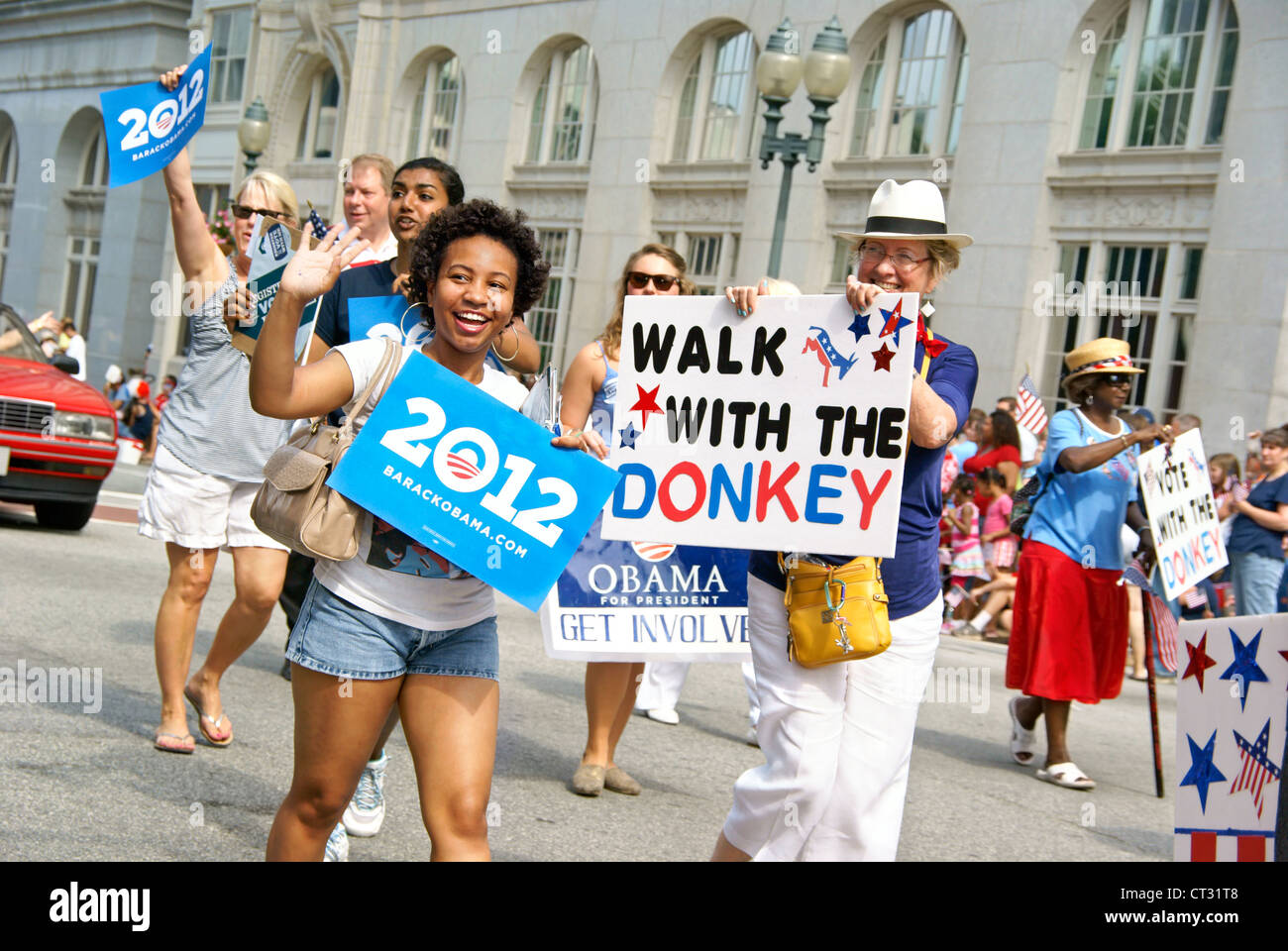 Democrats with Barack Obama signs participate in the 4th of July parade