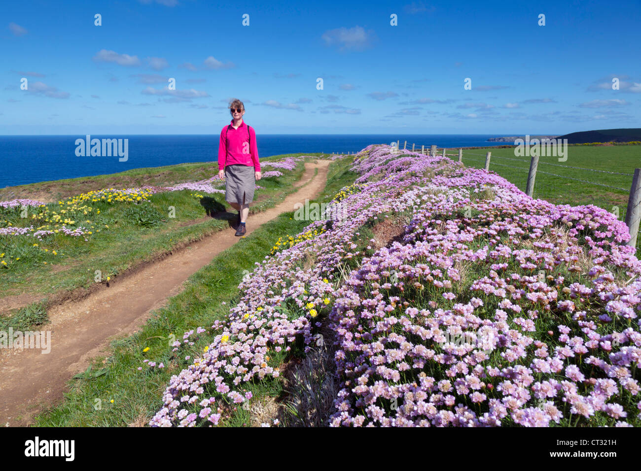 Walking the coastal path; Mawgan Porth; Cornwall; UK Stock Photo
