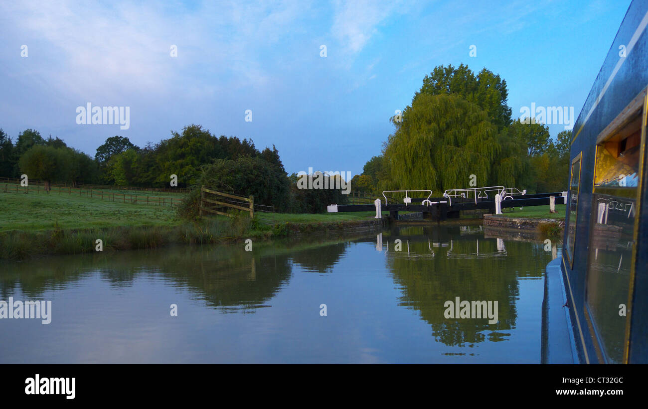 Barge boat moored on a canal near a lock in the autumn near Bradford-on-Avon Stock Photo