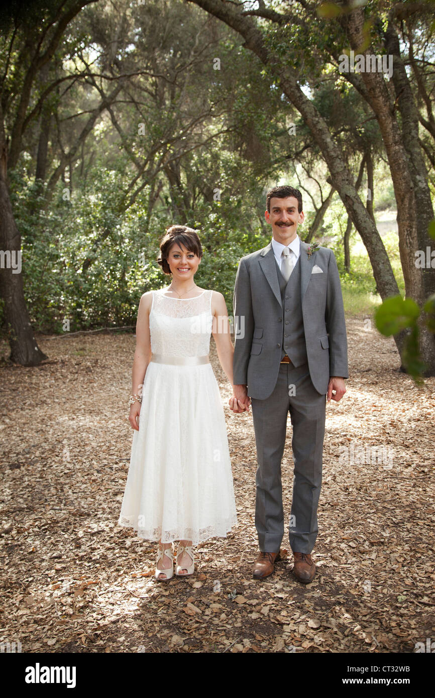 Bride and groom standing beside each other Stock Photo - Alamy