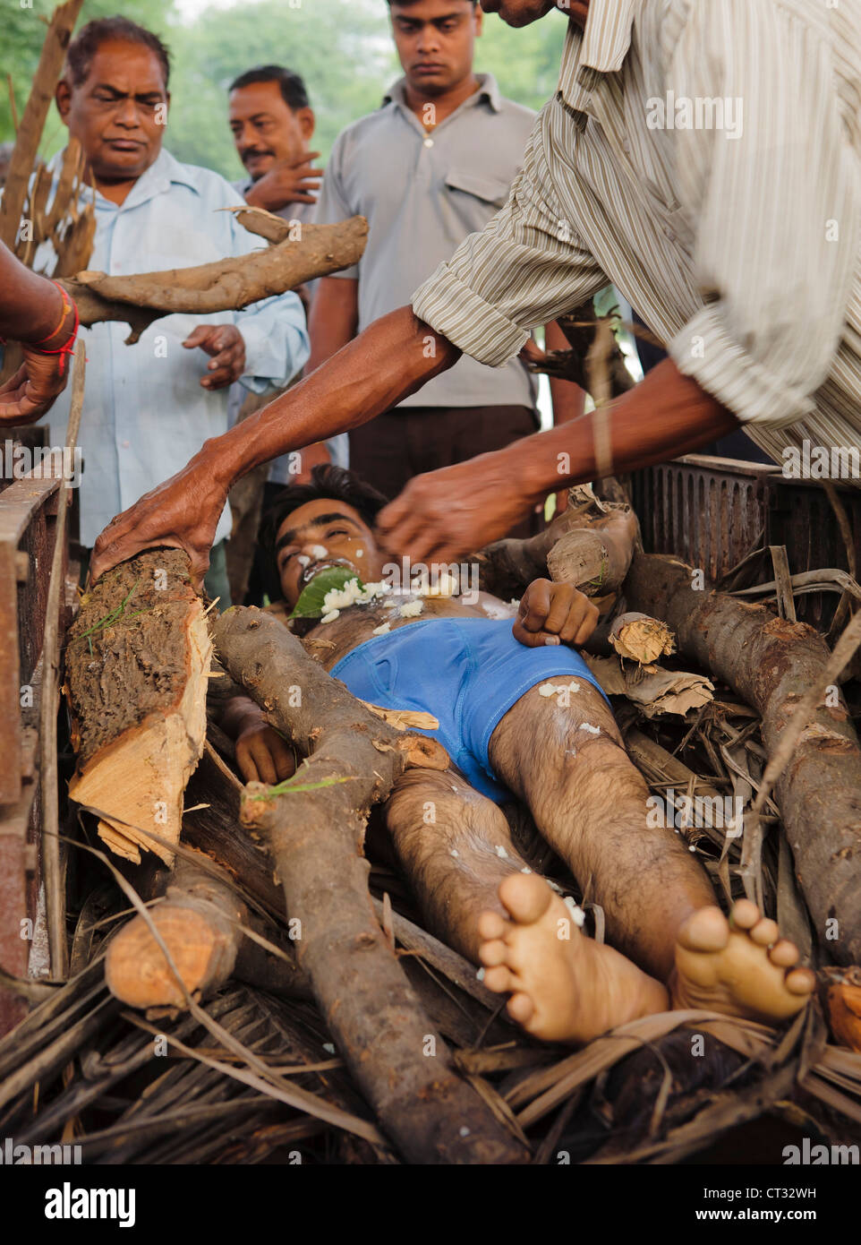 Body being prepared for cremation by the family and friend of deceased. Stock Photo