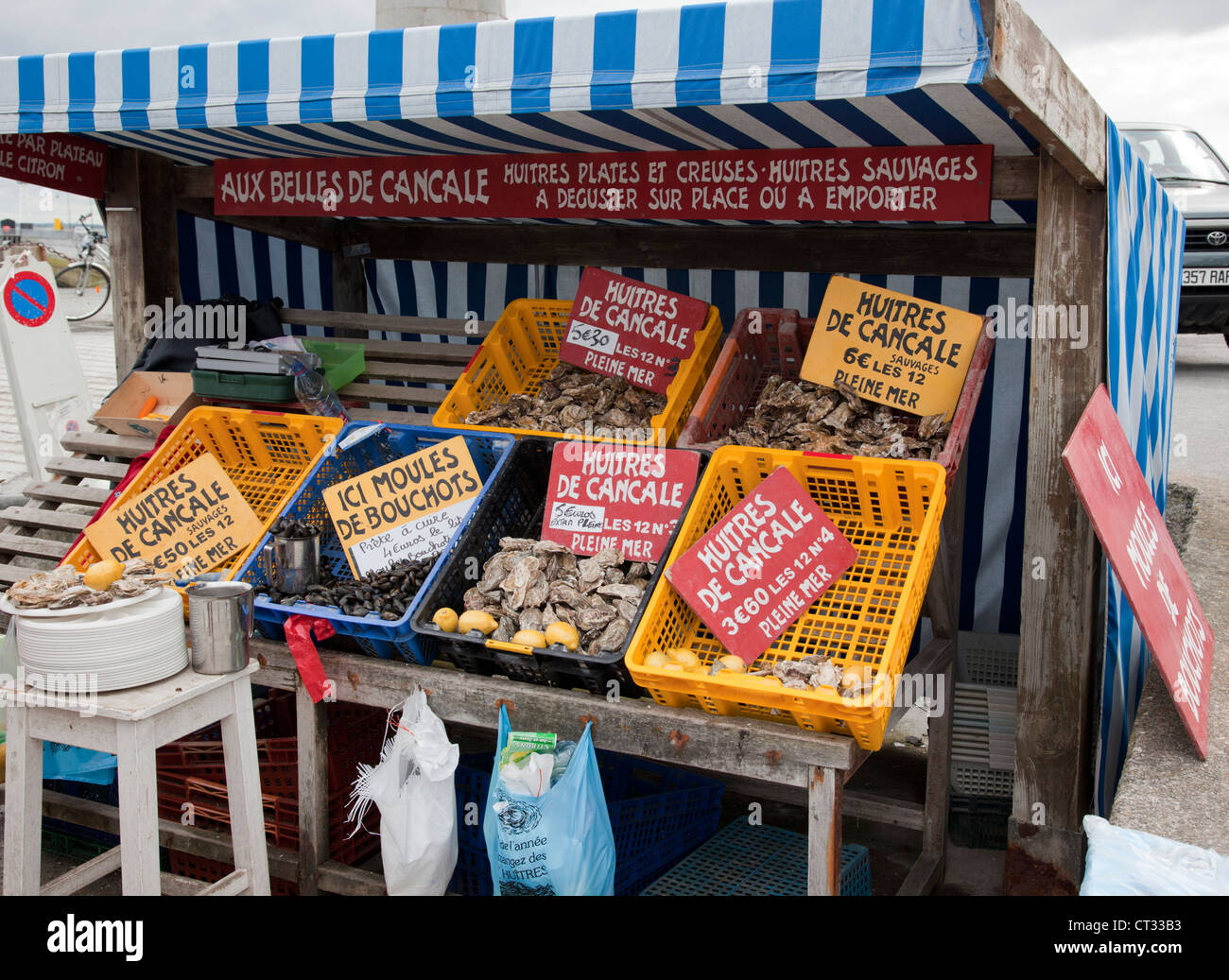 Oysters Moules De Bouchots for sale at a market stall from Cancale