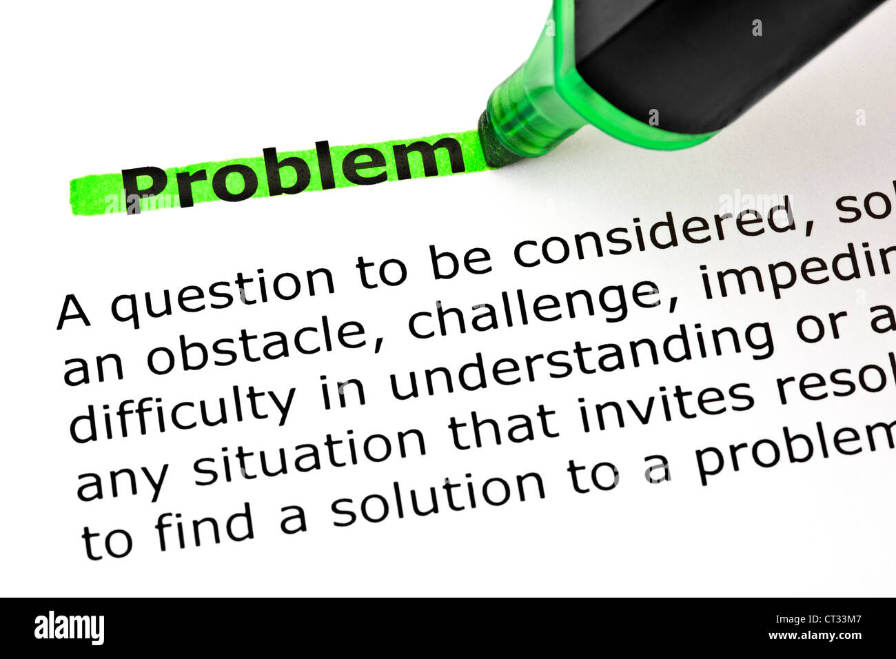 Definition of the word Problem highlighted with green marker on white paper. Stock Photo
