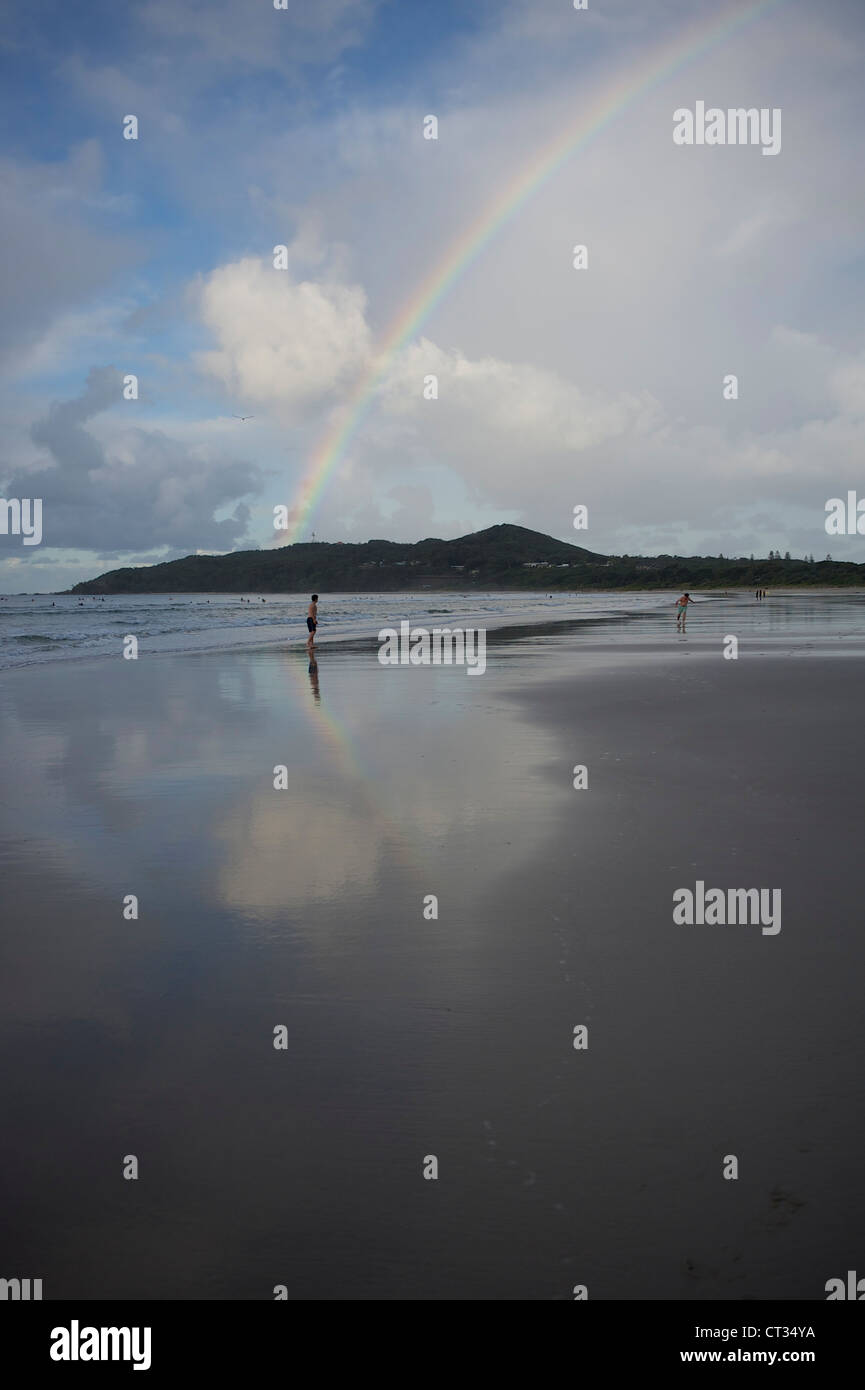 Rainbow over Cape Byron seen from the beach of Byron Bay, New South Wales, Australia Stock Photo