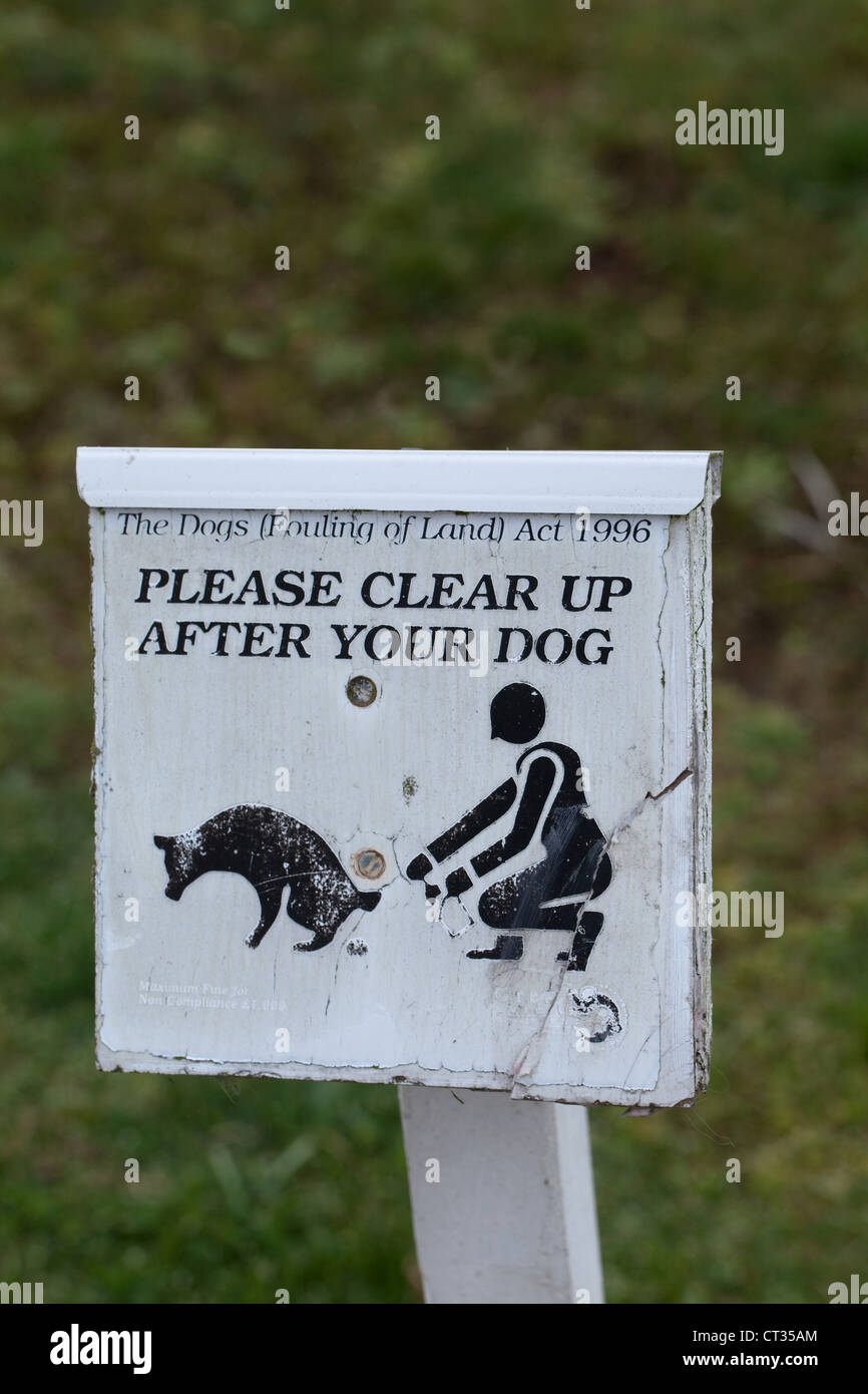 Dog (Canis lupus familiaris) Cleaning up sign. Refers to Fouling of Land Act 1996. Norfolk. Stock Photo