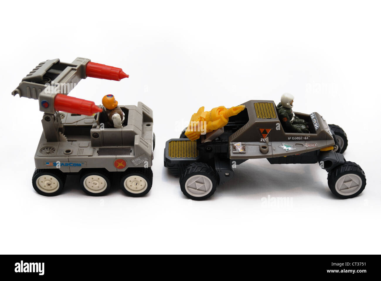 Two Starcom vintage space toys, land vehicles with guns, wheels and drivers. Stock Photo