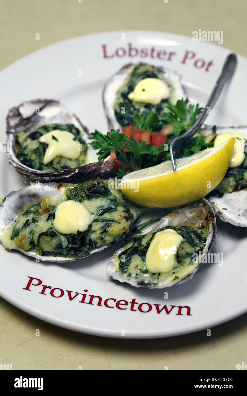 Oysters Rockefeller - oysters baked with spinach, Pernod and Parmesan, The Lobster Pot Restaurant, Provincetown, Cape Cod, USA Stock Photo