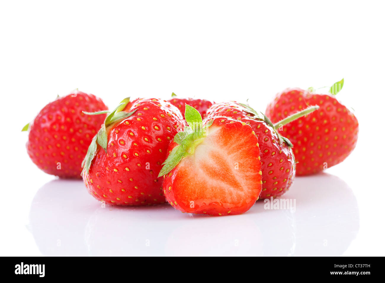 Couple of fresh strawberries in closeup over white background Stock ...