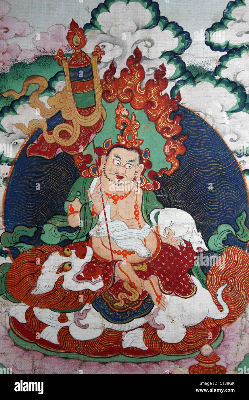Tibeto-Chinese Art  Of Kubera Seated on a Buddhist lion, a mongoose in one hand and a parasol in the other Stock Photo