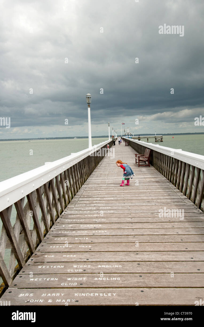 young girl on Yarmouth Pier on the Isle of Wight Stock Photo