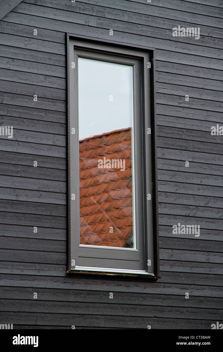 Window reflecting roof tiles Stock Photo Alamy