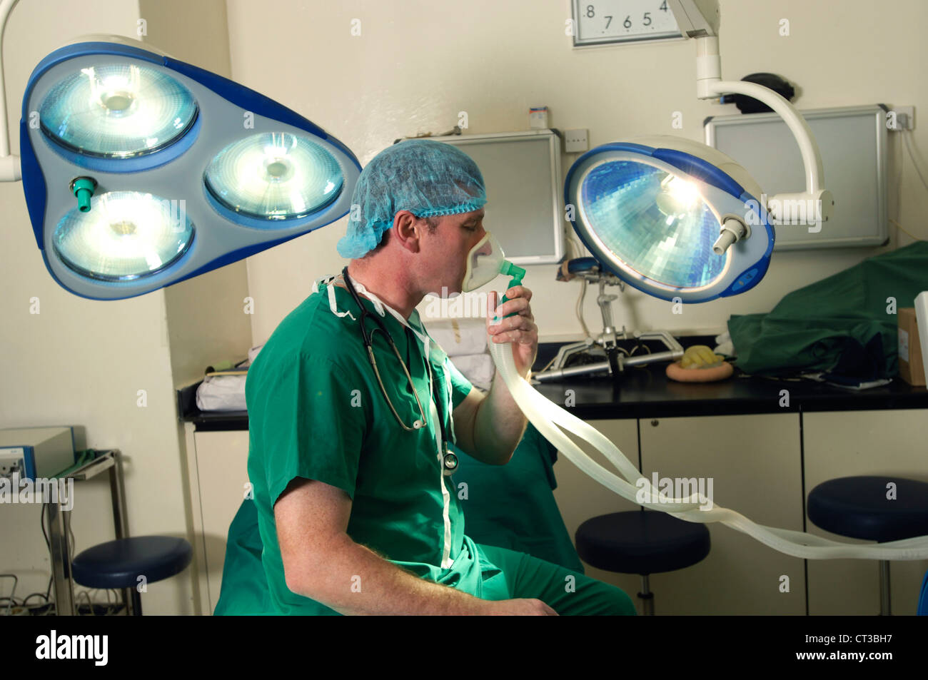 A surgeon using the gas and air (entonox) Stock Photo