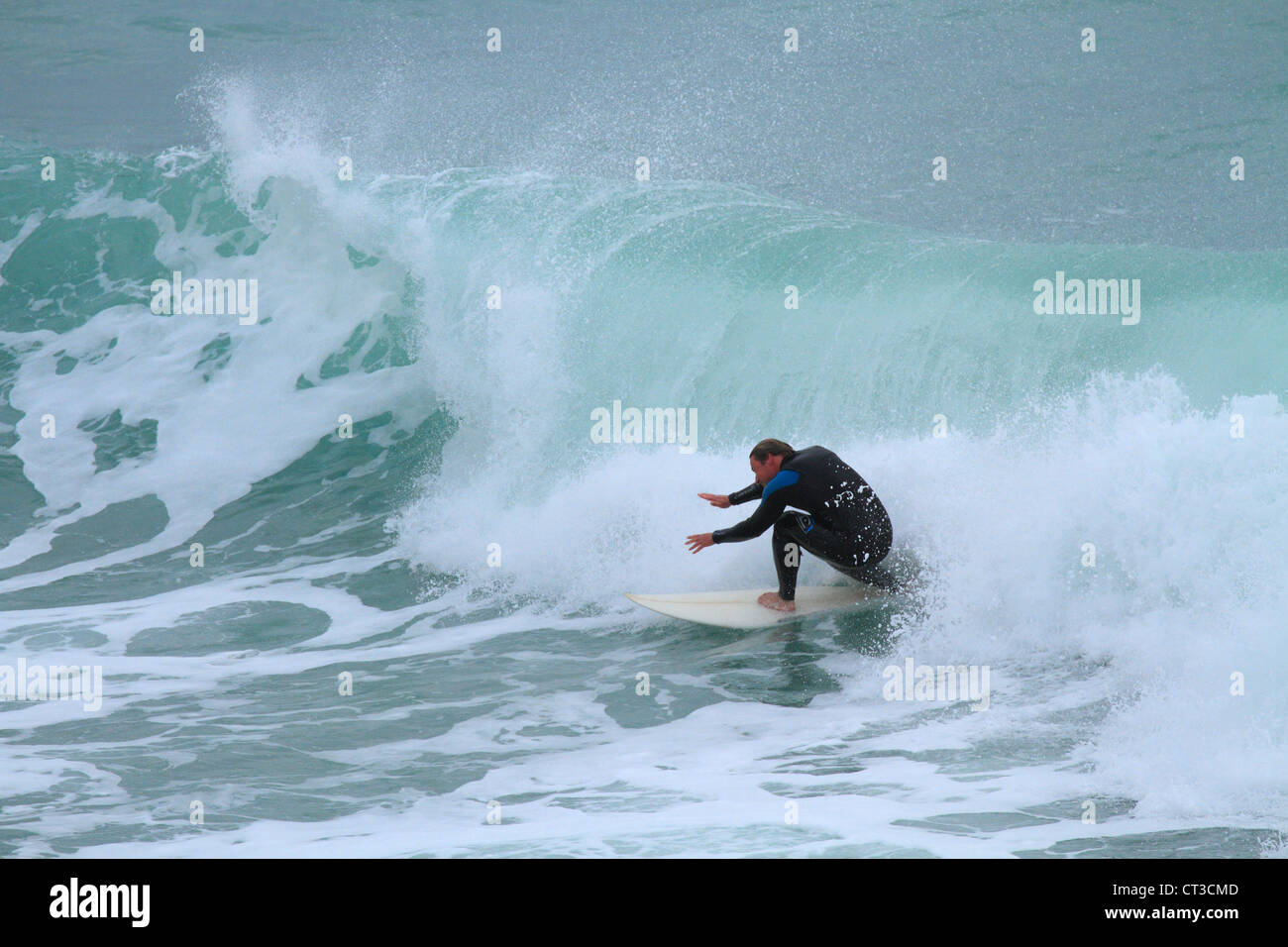 Surfer at Fistral beach, Newquay, North Cornwall, England, UK Stock Photo