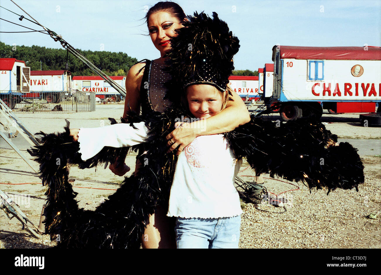 Dancer and circus kid with feather boa Stock Photo