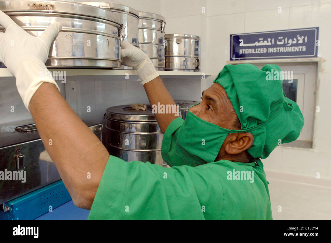 an-operating-theatre-support-worker-removing-sterilised-equipment-from