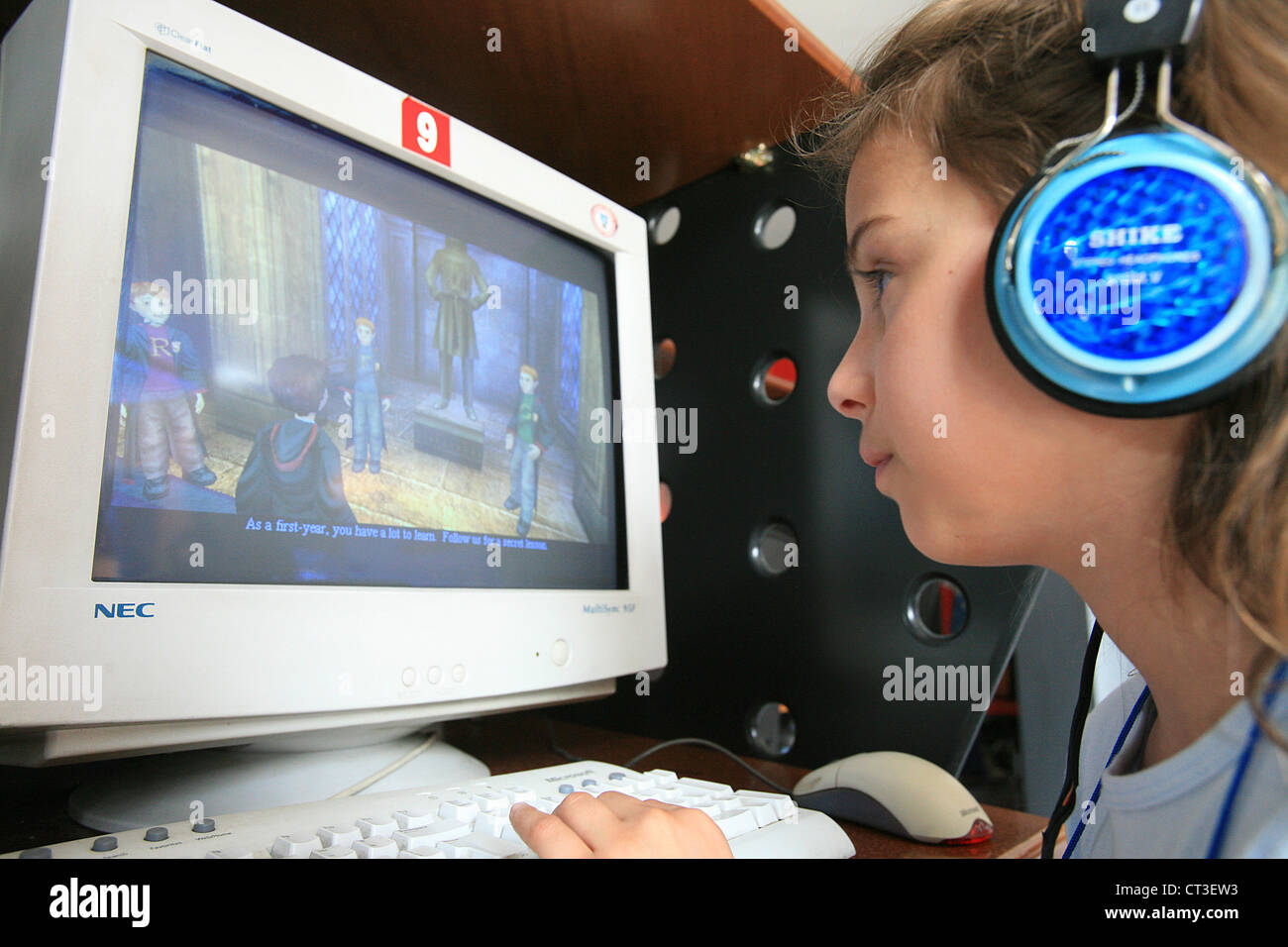 CHILD PLAYING WITH VIDEO GAME Stock Photo