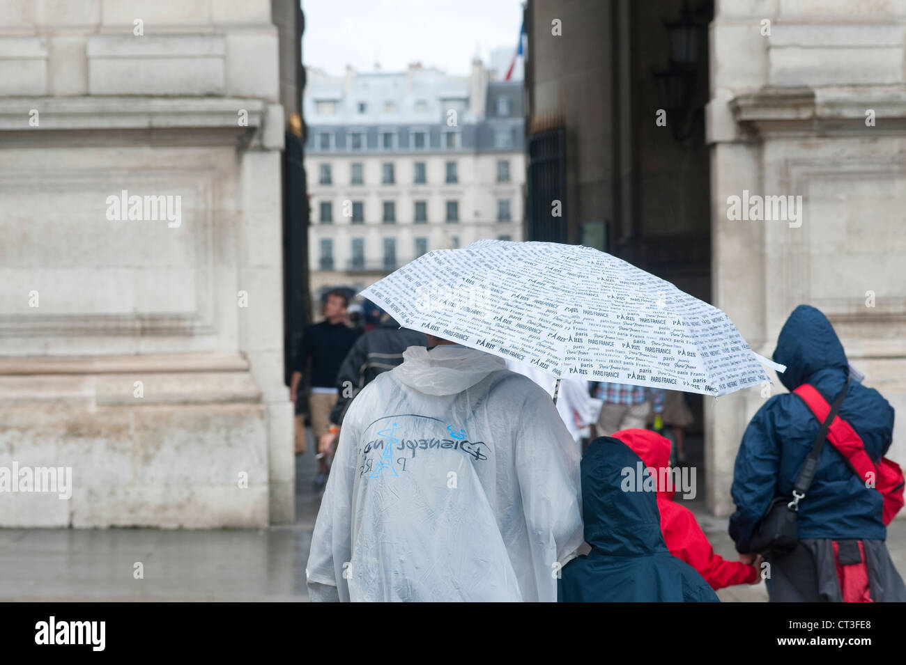 Paris, France - Tourists in a rainy day. Stock Photo