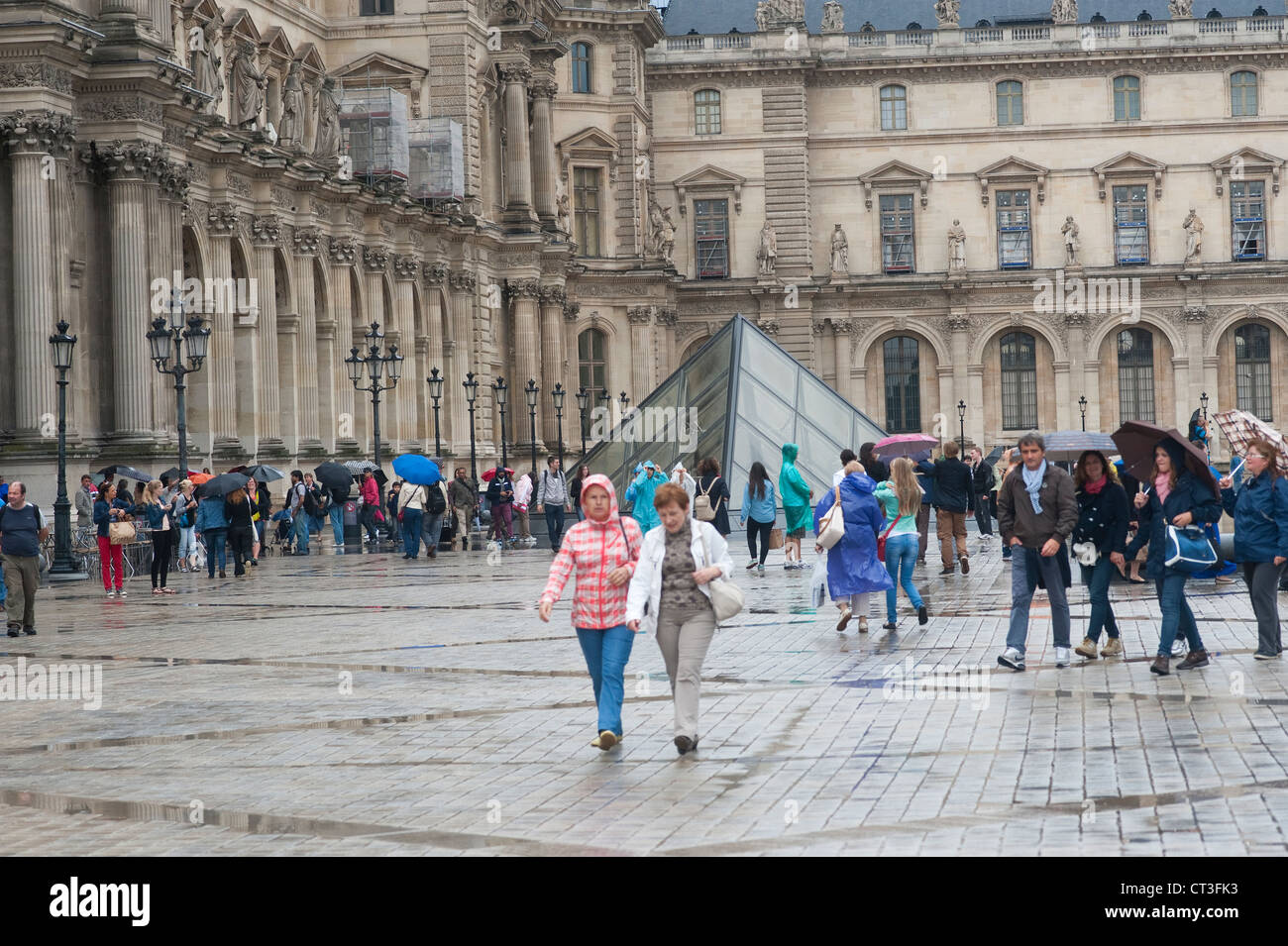 Paris, France - Tourists in a rainy day. Stock Photo