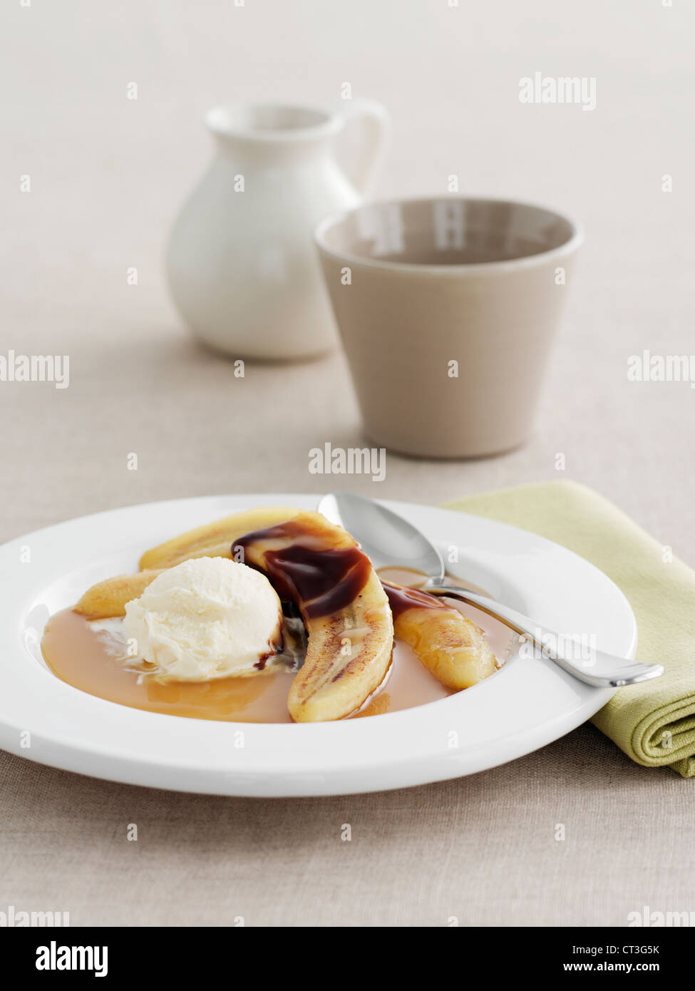 Plate of bananas, cream and sauce Stock Photo