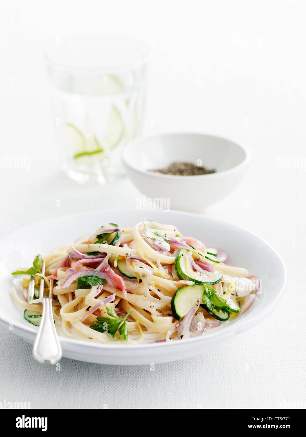 Plate of pasta and vegetables Stock Photo