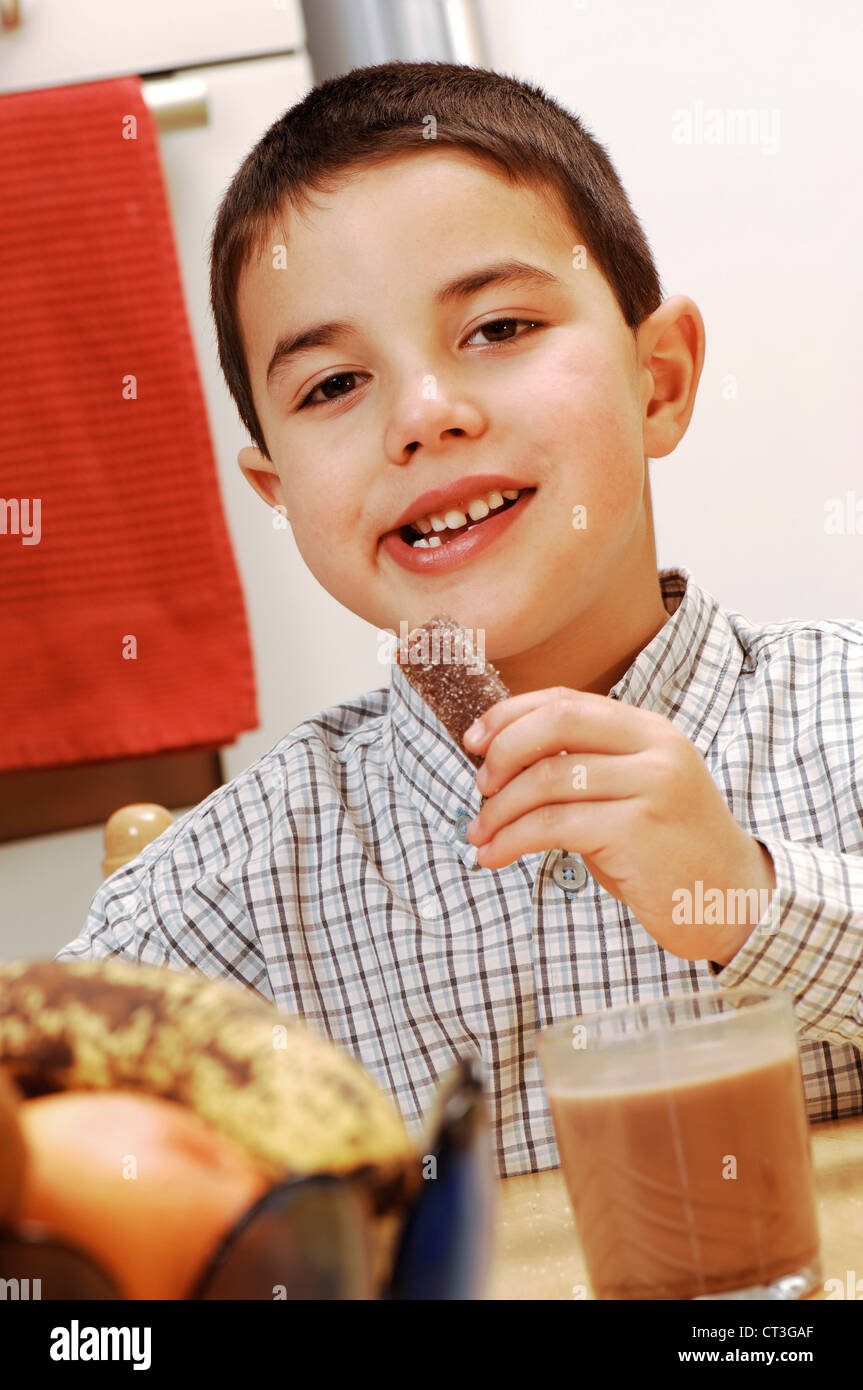 CHILD EATING SWEETS Stock Photo Alamy