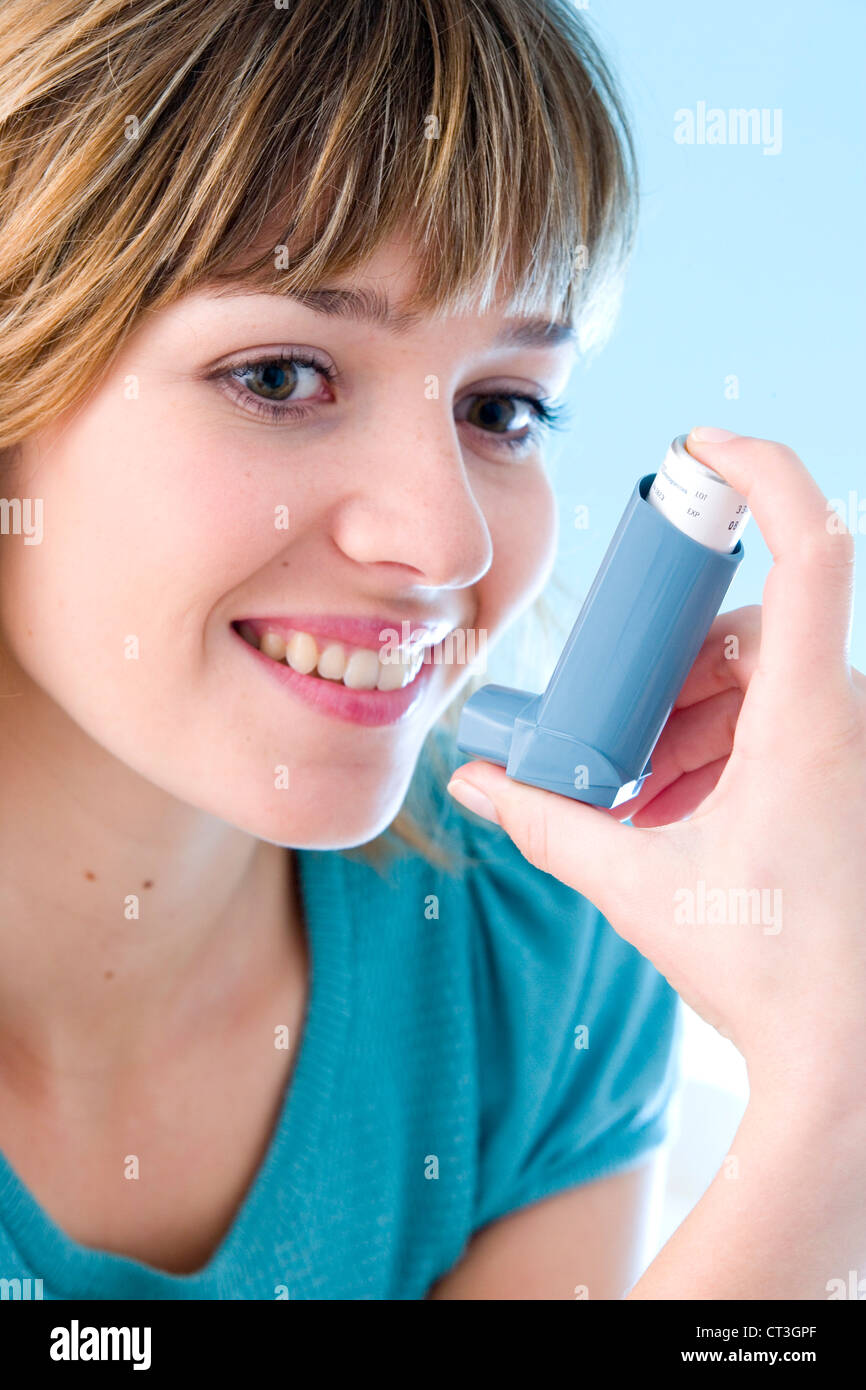 ASTHMA TREATMENT, WOMAN Stock Photo