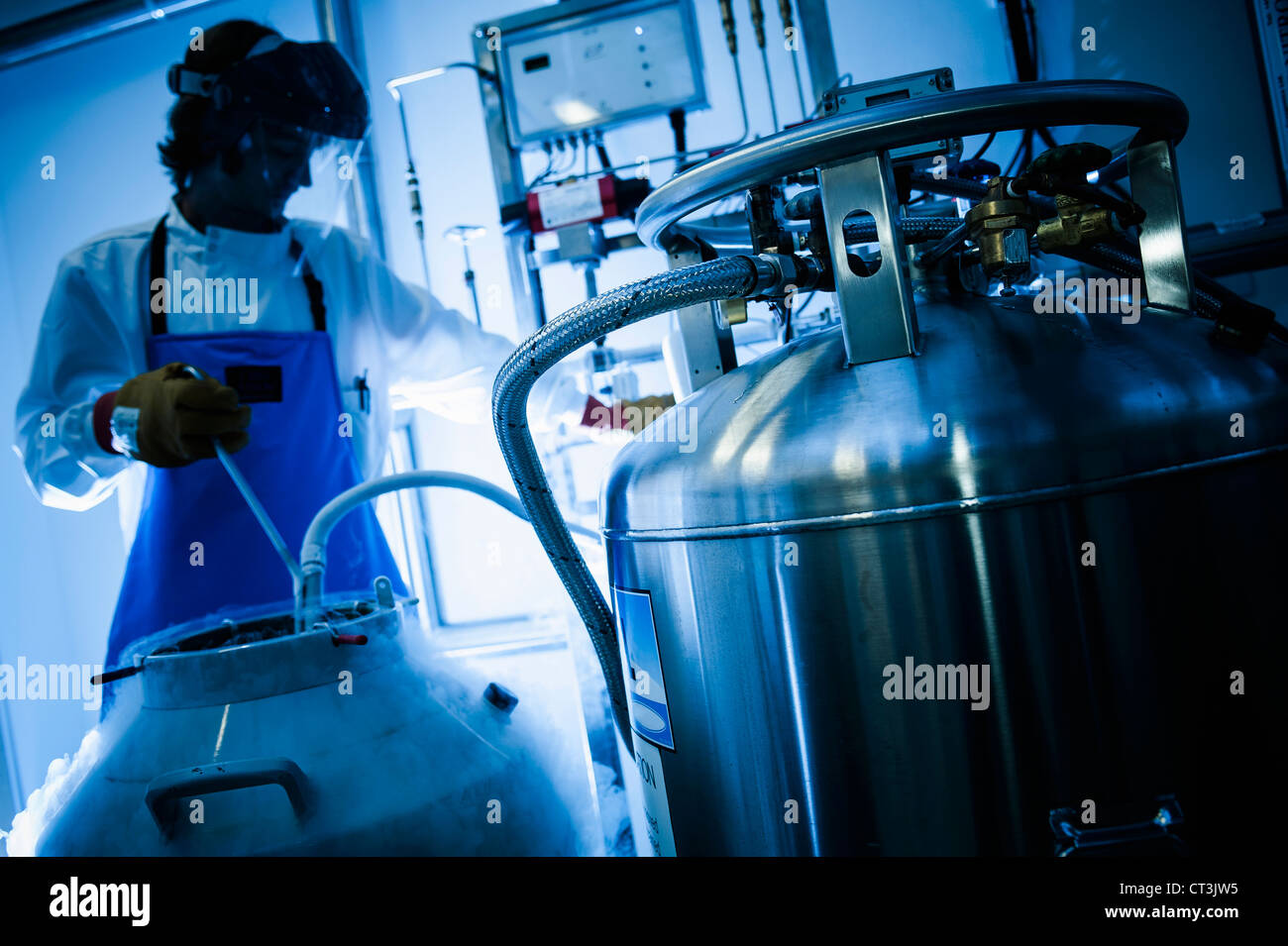 Scientist using gas tanks in lab Stock Photo Alamy