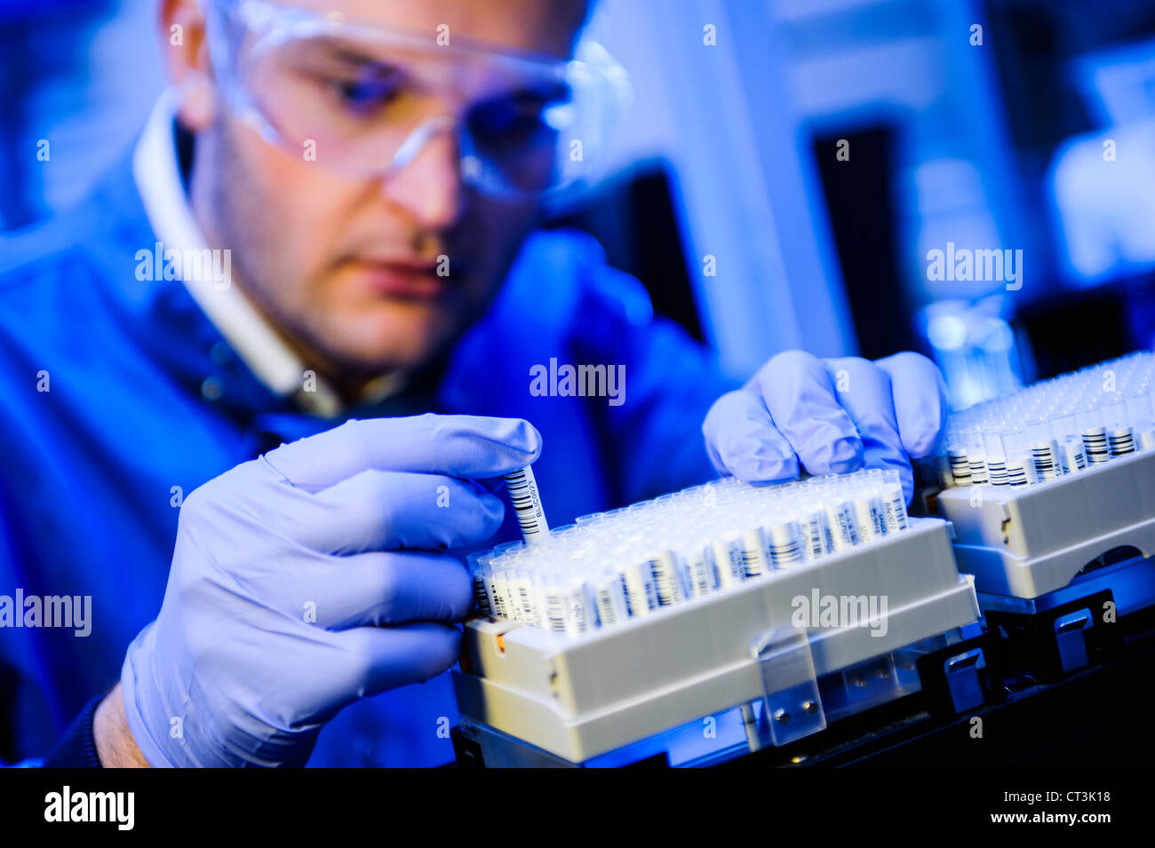 Scientist Examining Test Tubes In Lab Stock Photo Alamy
