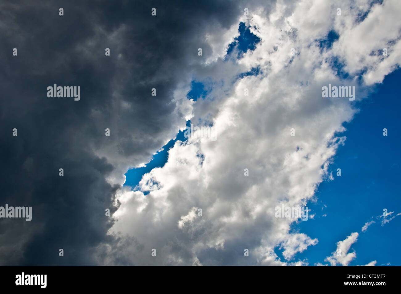 Black clouds and blue sky indicating that a storm is coming Stock Photo