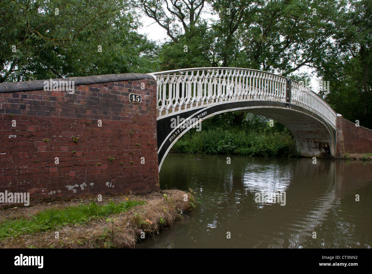 This Bridge number 45 at the entrance of the old Oxford canal - course of Newbold Arm is from Horsley Iron Works.. Stock Photo