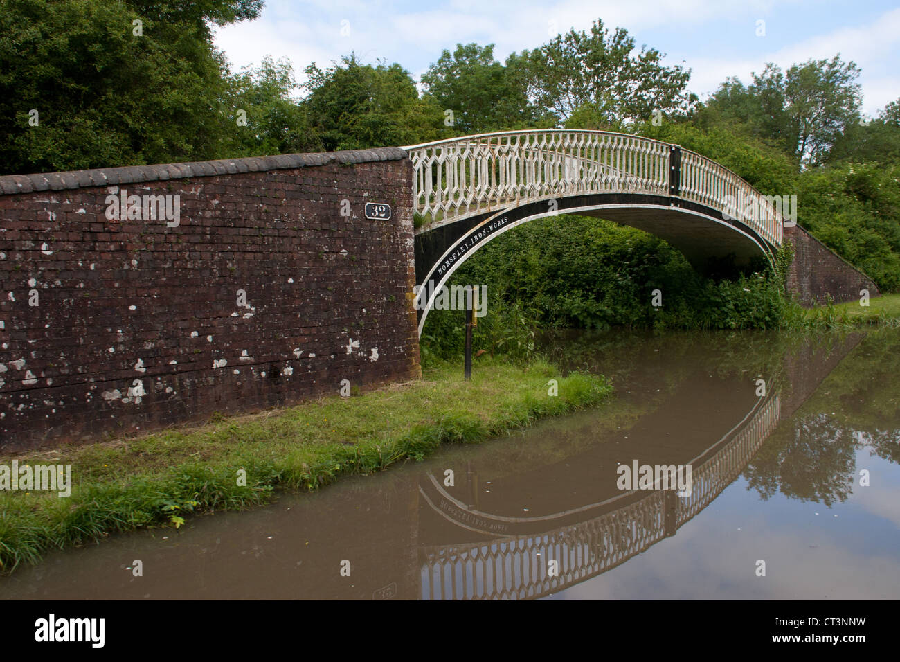 This wrought iron bridge number 32 over the old Brinklow course of the Oxford canal canal - was made by Horsley Iron works. Stock Photo