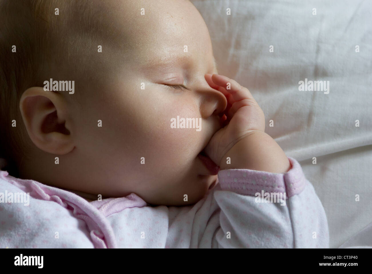 Baby girl asleep hi-res stock photography and images - Alamy