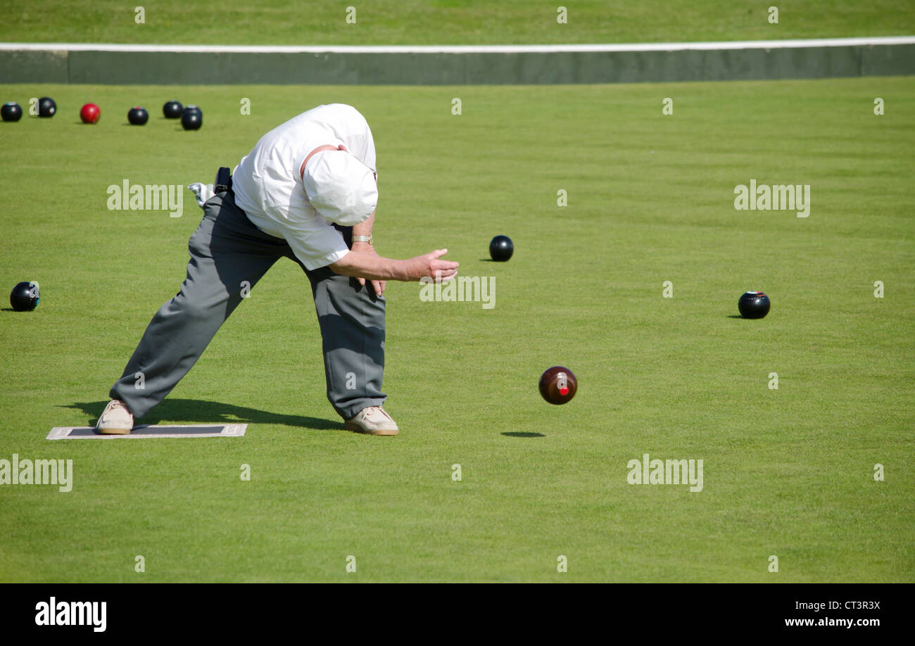 Retired man playing bowls Stock Photo