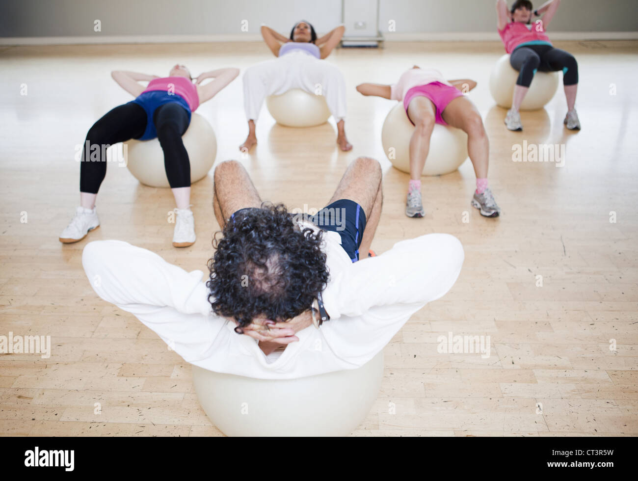 Women on exercise balls in gym class Stock Photo Alamy