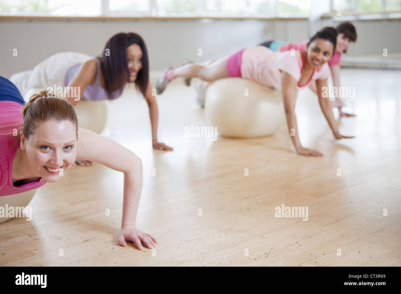 Women on exercise balls in gym class Stock Photo Alamy
