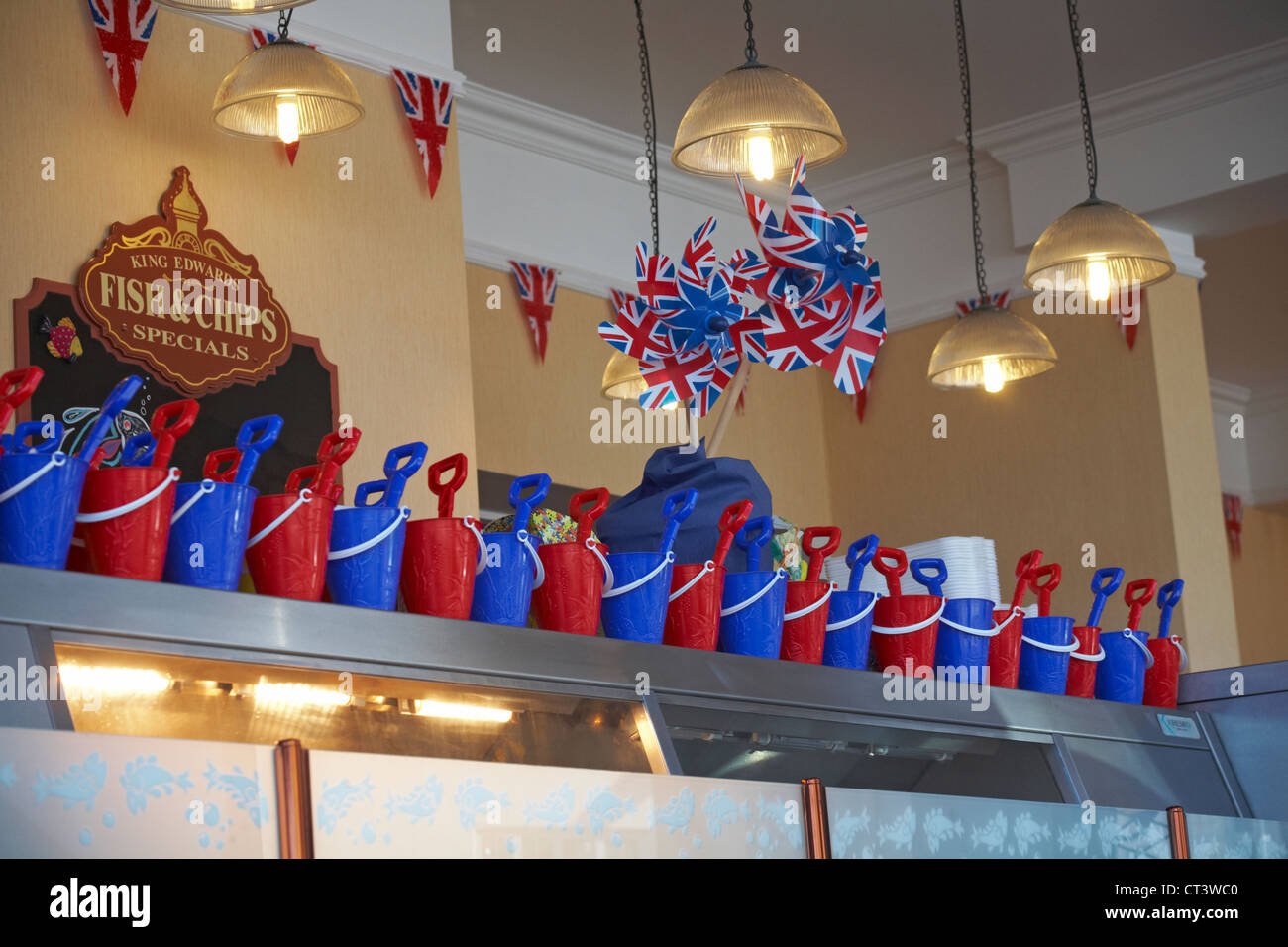 red and blue buckets and spades in which chips are served for children