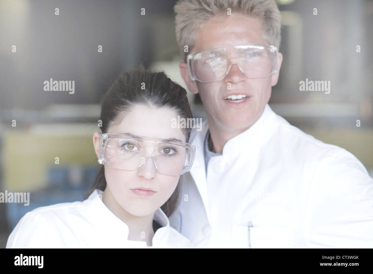 Scientists wearing goggles in lab Stock Photo Alamy