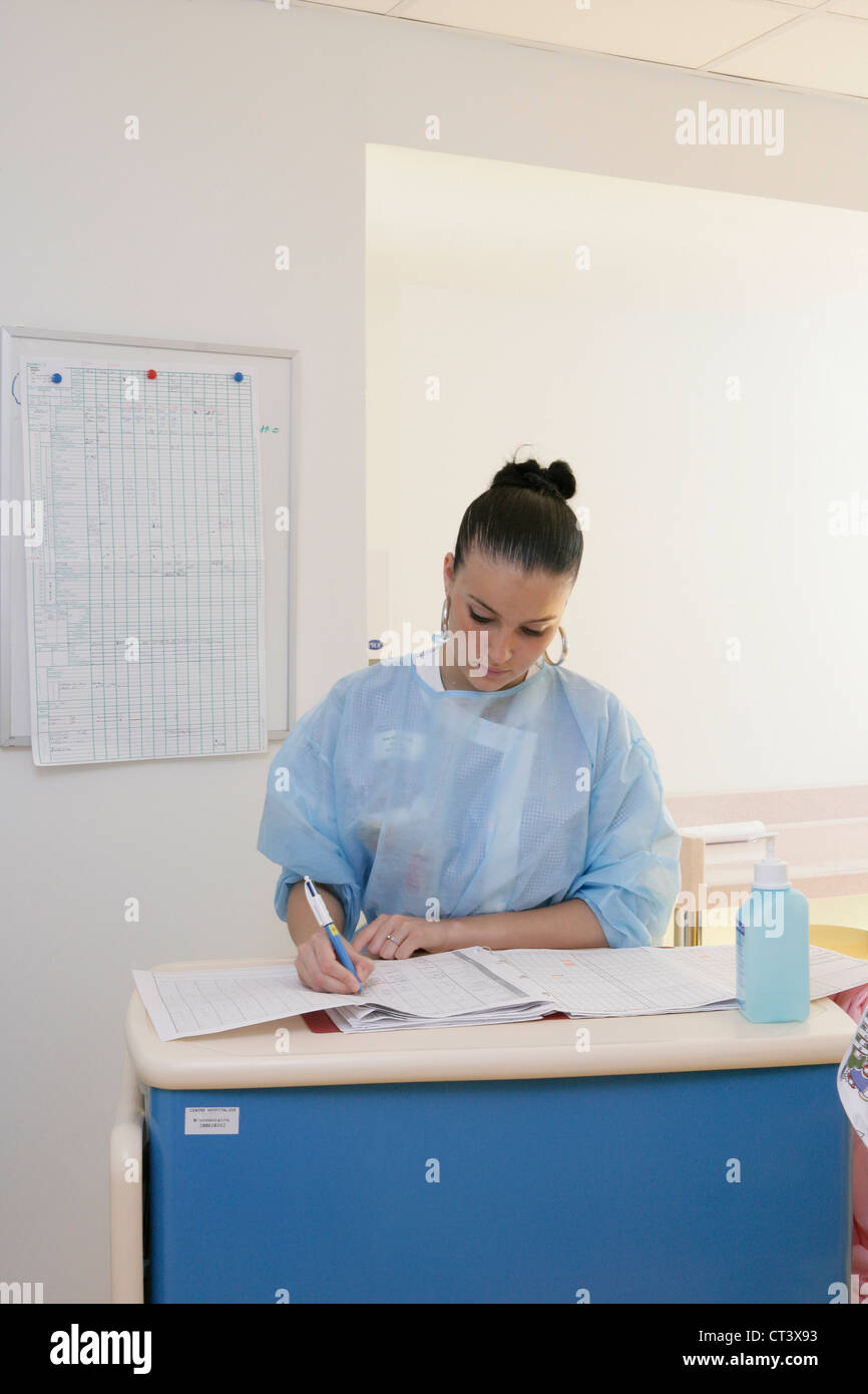 NURSE WITH PATIENT'S RECORD Stock Photo