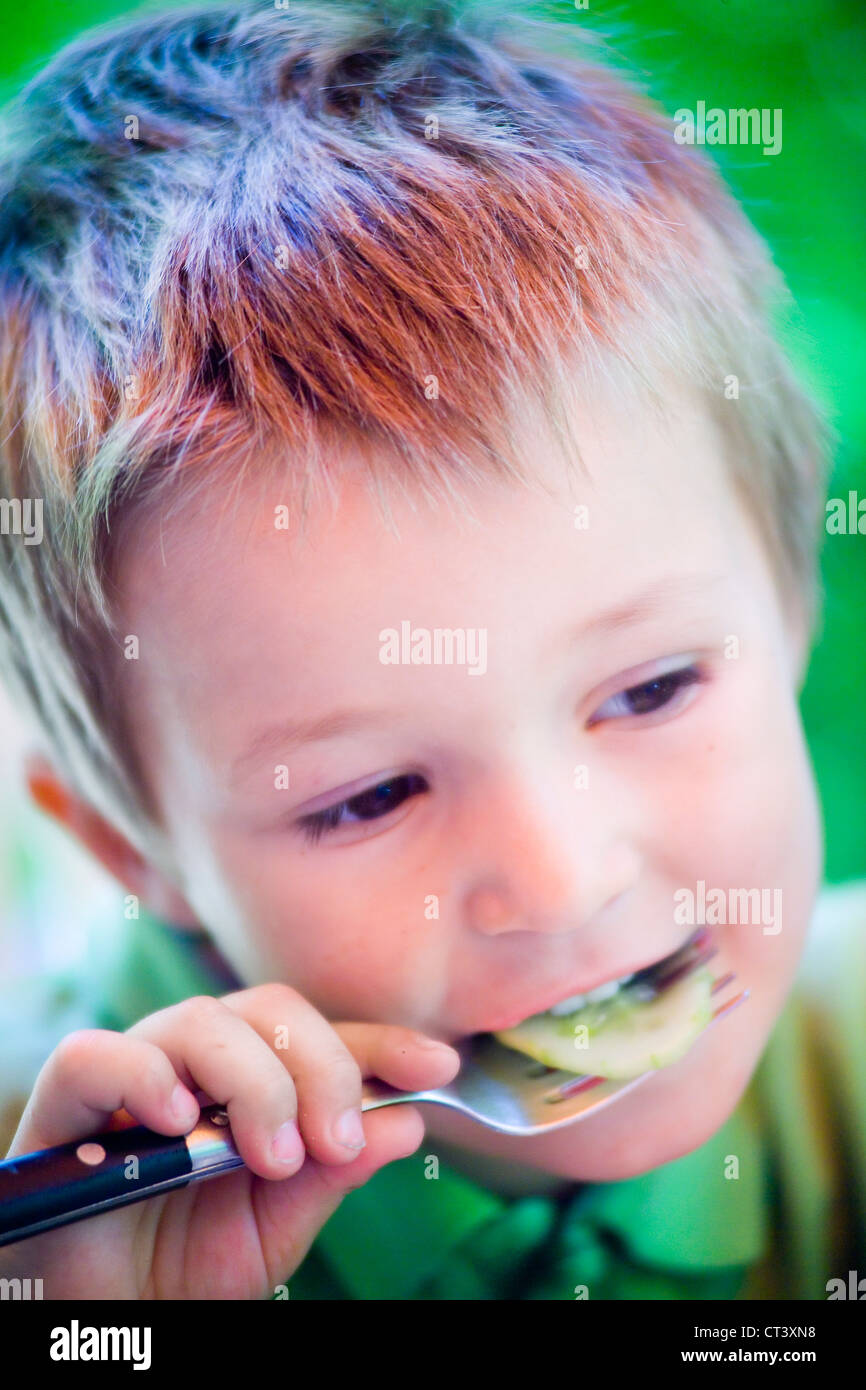 CHILD EATING RAW VEGETABLES Stock Photo Alamy