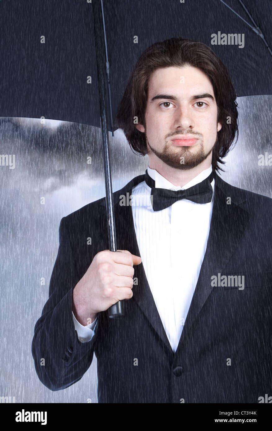 Man black suit umbrella storm hires stock photography and images Alamy