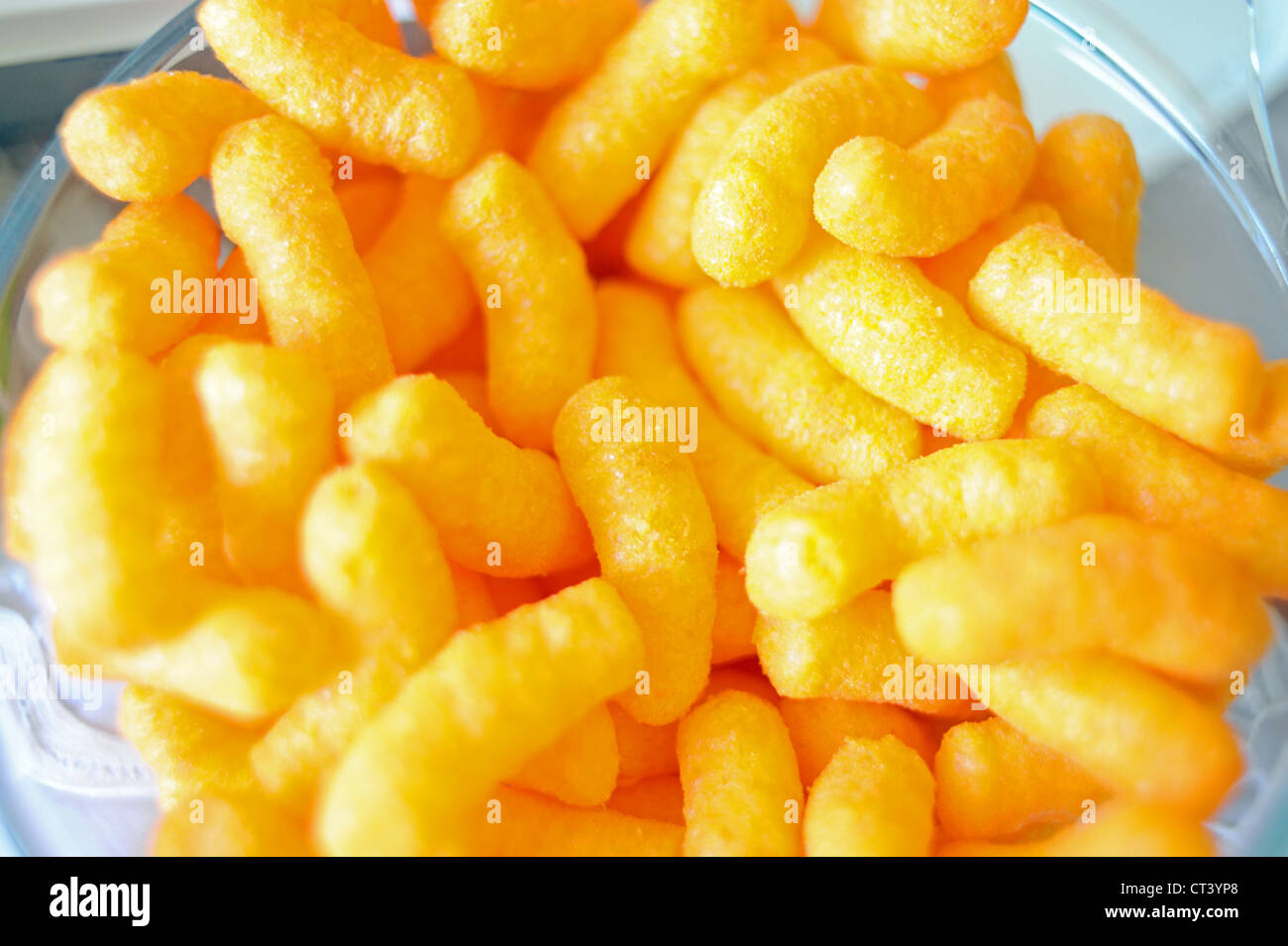 Bright orange coloured cheese wotsit snack food Stock Photo Alamy