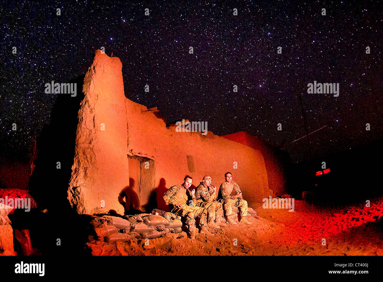 US Army paratroopers with the 82nd Airborne Division look out at the night sky at Joint Security Station Hasan June 11, 2012 in southern Ghazni Province, Afghanistan. Erected just weeks earlier in southern Gilan District, the rural post has a virtually unobstructed view of the heavens on clear nights. Stock Photo